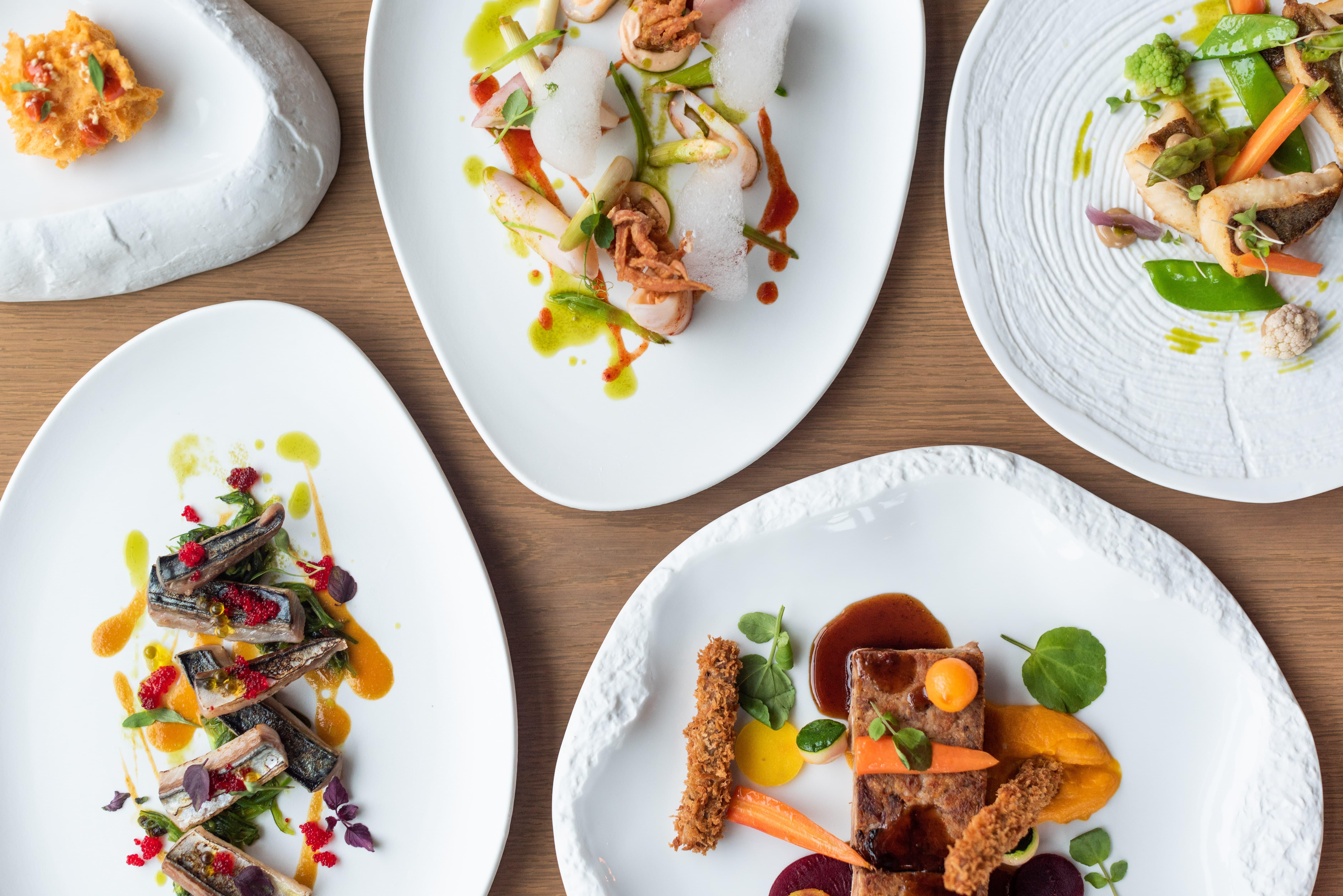 Aguas De Ibiza Grand Luxe Hotel - Small Luxury Hotel Of The World Santa Eularia des Riu Esterno foto Dishes at the restaurant