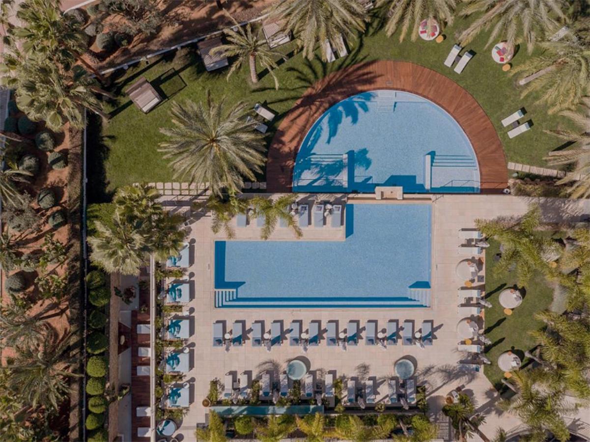 Aguas De Ibiza Grand Luxe Hotel - Small Luxury Hotel Of The World Santa Eularia des Riu Esterno foto Aerial view of the pool at the Four Seasons Hotel