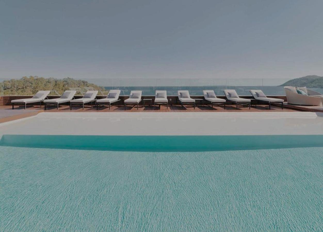 Aguas De Ibiza Grand Luxe Hotel - Small Luxury Hotel Of The World Santa Eularia des Riu Esterno foto The pool at the hotel