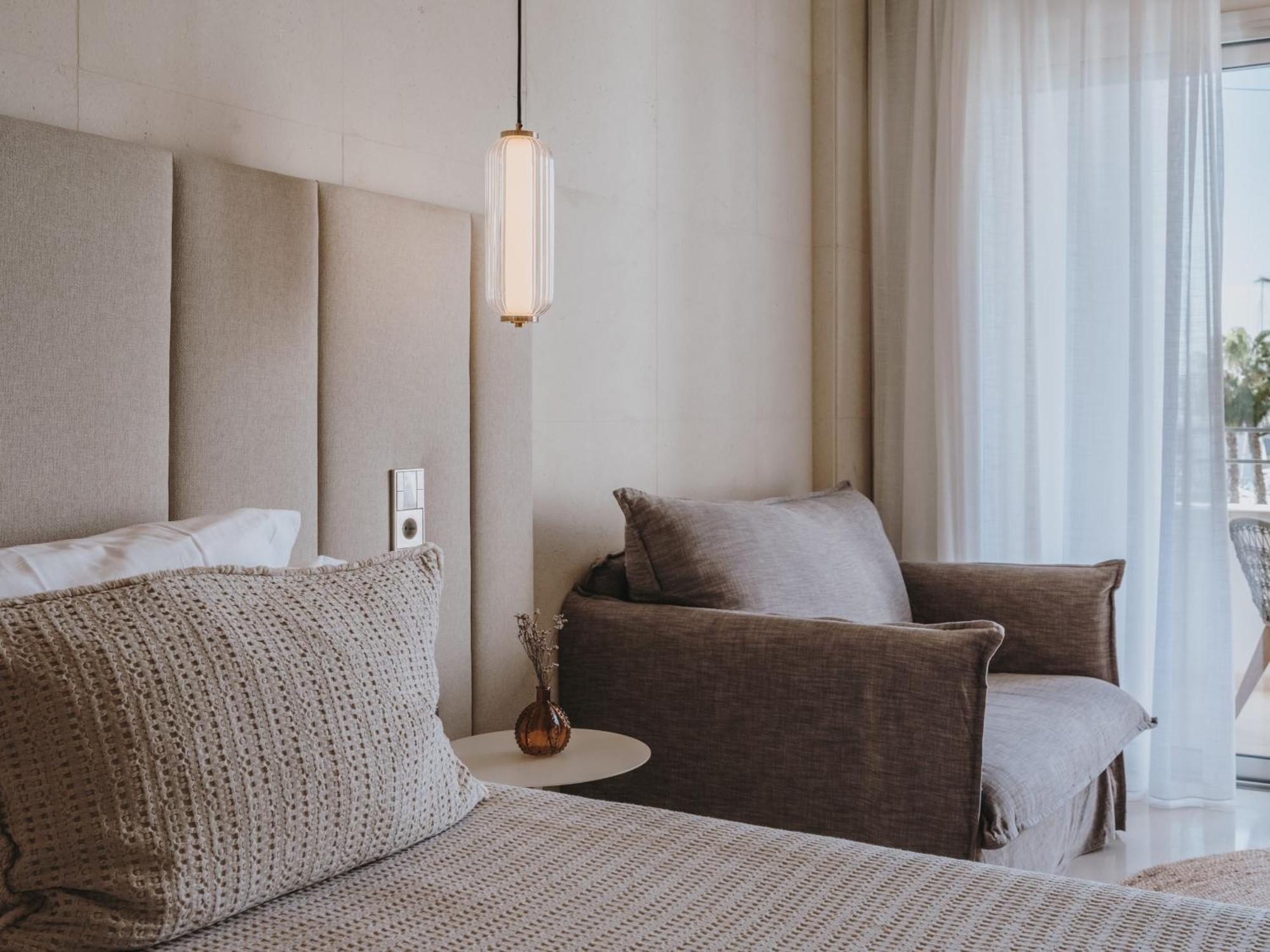 Aguas De Ibiza Grand Luxe Hotel - Small Luxury Hotel Of The World Santa Eularia des Riu Esterno foto A bedroom at the hotel